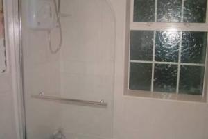 A new electric shower replaced the original shower.  from project Diary Of A Bathroom Refit, Castleknock, Dublin 15