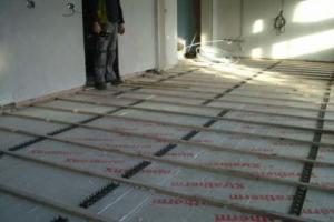 We first prepare the floor by laying tracks across the floor. These tracks will keep the heating pipes level on the floor.  from project Underfloor Heating, Ballsbridge, Dublin 4