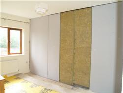 The wall is then faced with two layers of sound check plasterboard.  from project RTE Sound Proofing Project