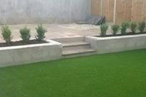 Sloping north facing garden with raised beds with granite patio and artificial grass. from project Artificial Grass