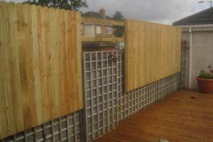Timber fencing bolted to wall from project Fencing and Walling