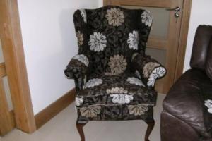 After, a wing chair beautifully reupholstered and ready for many more years of service.  from project Chair Upholstery Dublin