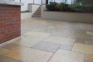 and after from project Limestone Patio with Decorative Walls